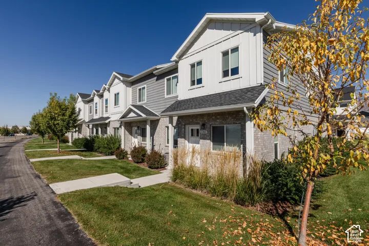 Row of multi-story residences featuring varied siding and brick exteriors