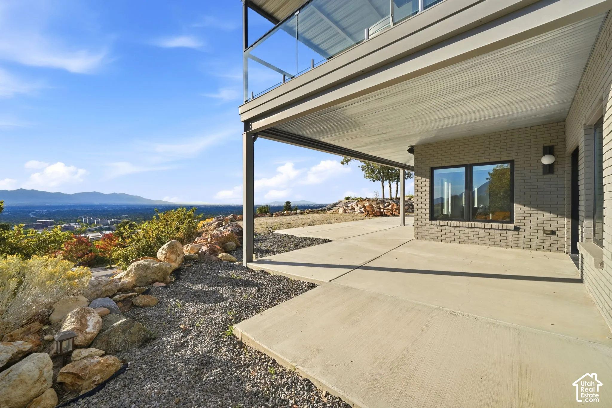 Ground-level patio with concrete surfacing and an overhead covering