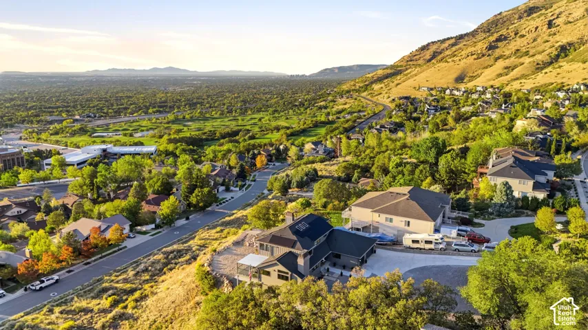 Residential neighborhood with expansive green spaces and mountainous terrain