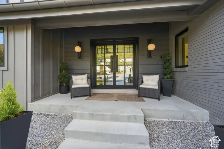 Concrete entry steps leading to a spacious porch