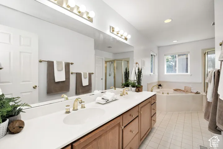 Dual vanity with brass fixtures and ample counter space