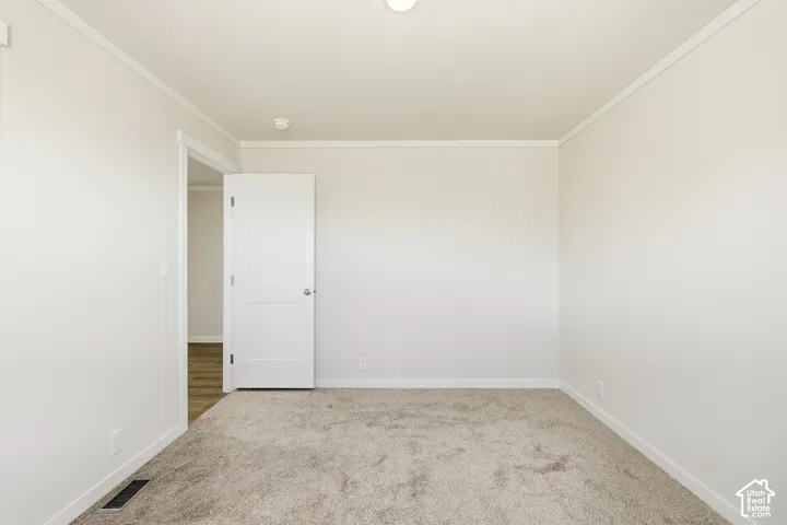 Neutral wall paint with crown molding