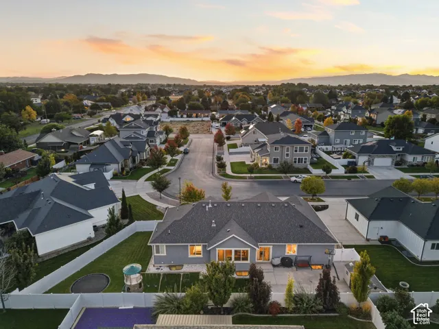 Aerial perspective of a residential neighborhood with mountain scenery