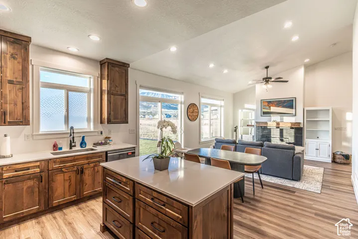 Open-concept living space featuring wood-finish flooring and recessed lighting