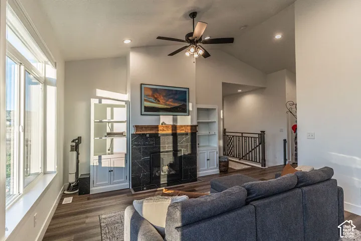 Vaulted ceilings, recessed lighting, and wood-finish flooring