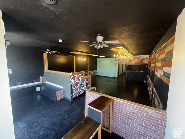 Open concept interior featuring black flooring and ceiling