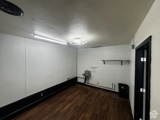 Wood-finish flooring with a contrasting dark baseboard