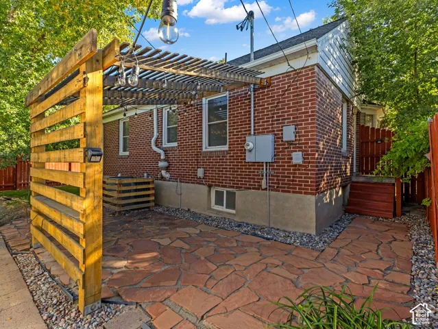 You will LOVE the beautiful, well-designed backyard! Two seating areas, flagstone patio with covered portico, and more! Fully fenced and private.
