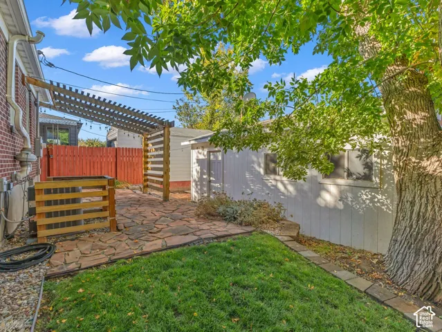 You will LOVE the beautiful, well-designed backyard! Two seating areas, flagstone patio with covered portico, and more! Fully fenced and private. Also, see the oversized 1-car garage.