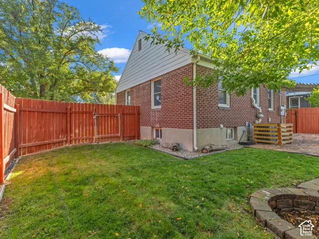 You will LOVE the beautiful, well-designed backyard! Two seating areas, flagstone patio with covered portico, and more! Fully fenced and private.