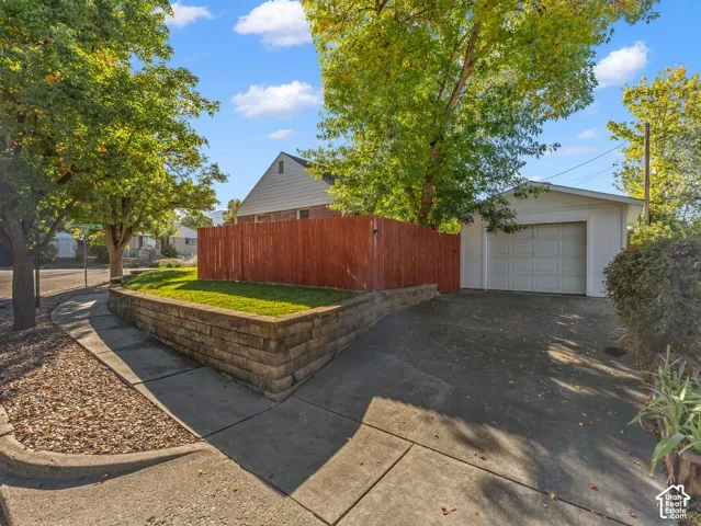 Side of home with oversized 1-car garage.
