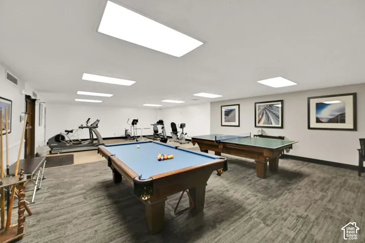 Recreational room featuring a pool table, ping pong table, and various exercise equipment