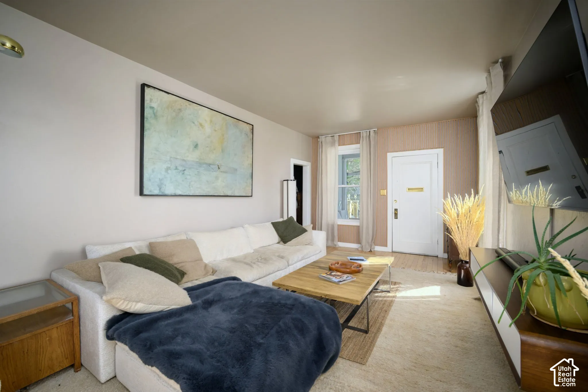 Light-toned walls complement wood-finish flooring