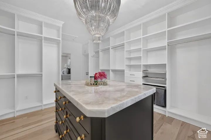 Custom closet system featuring extensive shelving, hanging rods, and built-in drawers