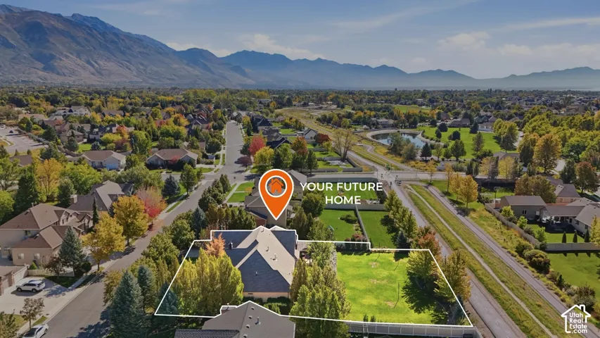 Expansive property featuring a substantial grassy area, mature trees, and a multi-gabled roofline
