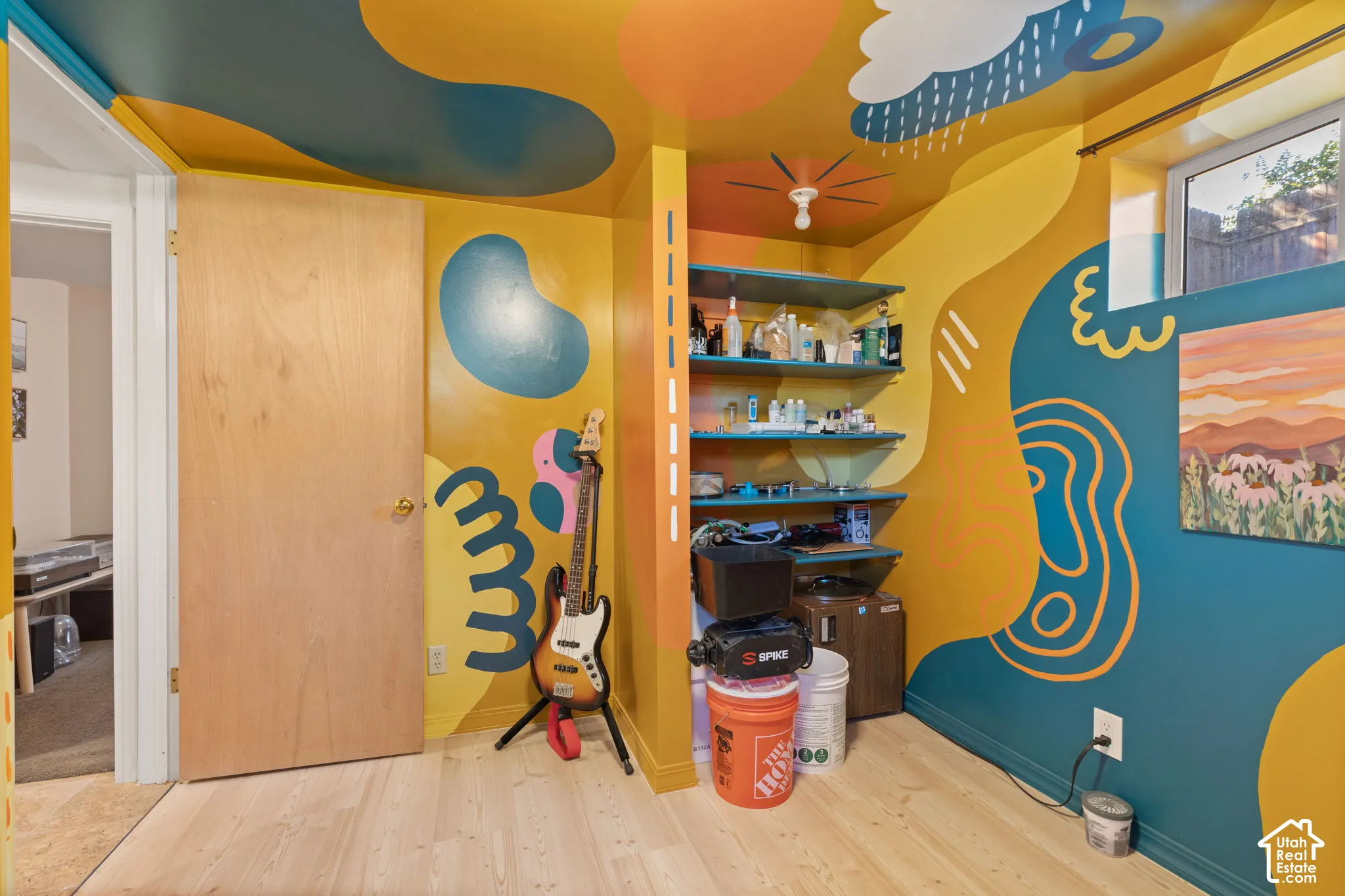 Wood-finish flooring with a multi-colored wall mural