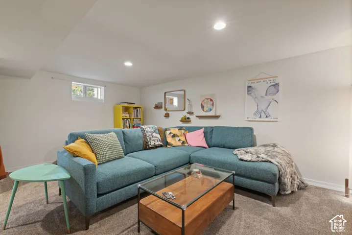 Carpeted flooring, recessed lighting, and a built-in window