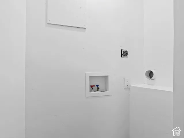 Utility connections with a dedicated outlet and white walls