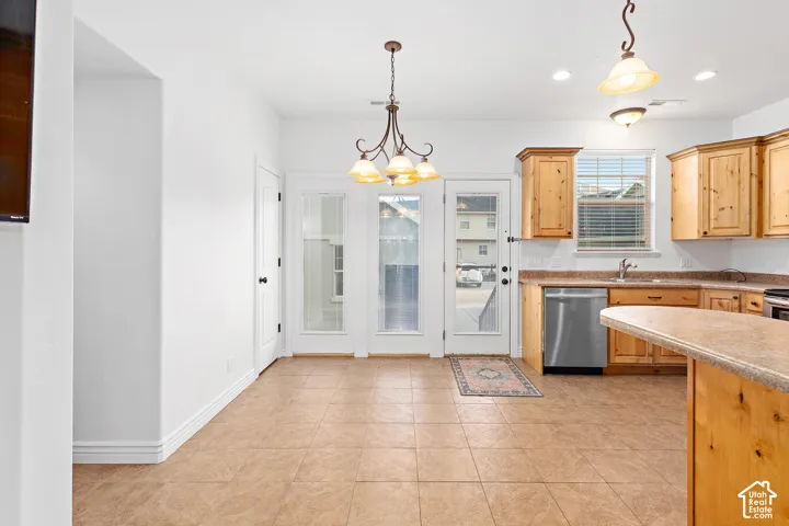 Kitchen featuring wood cabinetry, stainless steel appliances, and a tiled backsplash