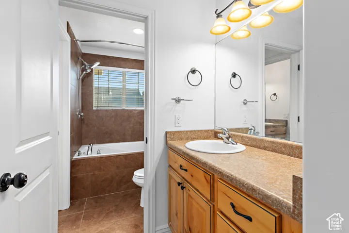 Vanity with a composite countertop and integrated sink
