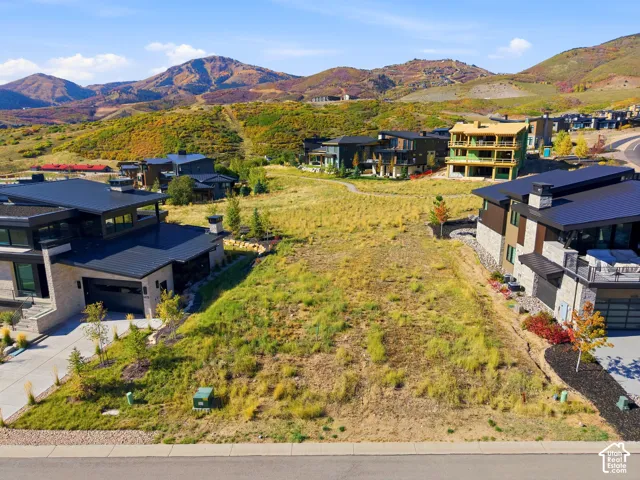 Expansive building lot featuring natural terrain and surrounding mountainous scenery