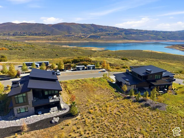 Modern architecture featuring dark-pitched roofs and expansive windows