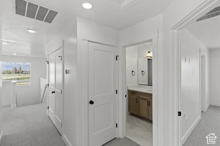 White interior walls with recessed lighting