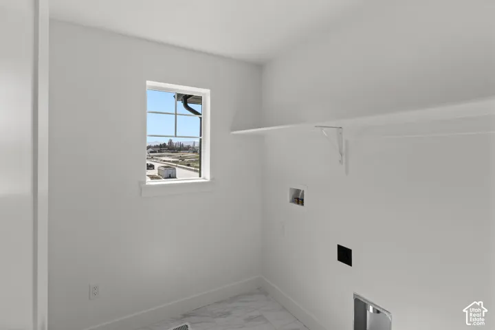 Window with grid pattern, wall-mounted shelving, and wood-finish flooring