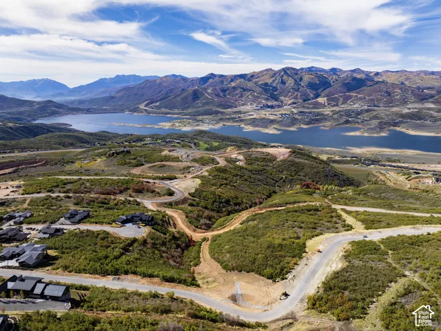 Sweeping mountain scenery and expansive lake presence define this elevated community setting