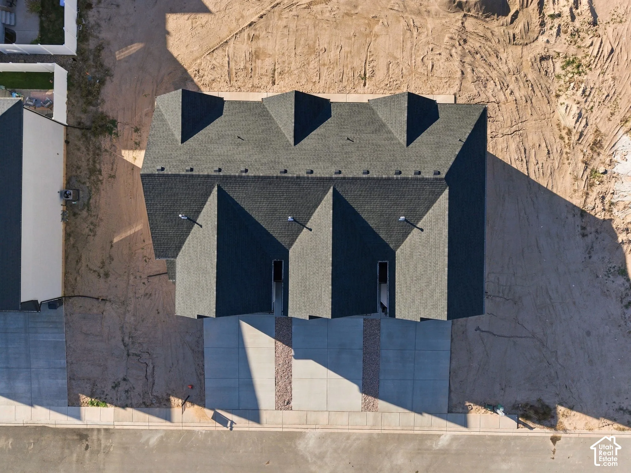 Multiple residential units featuring dark shingle roofing