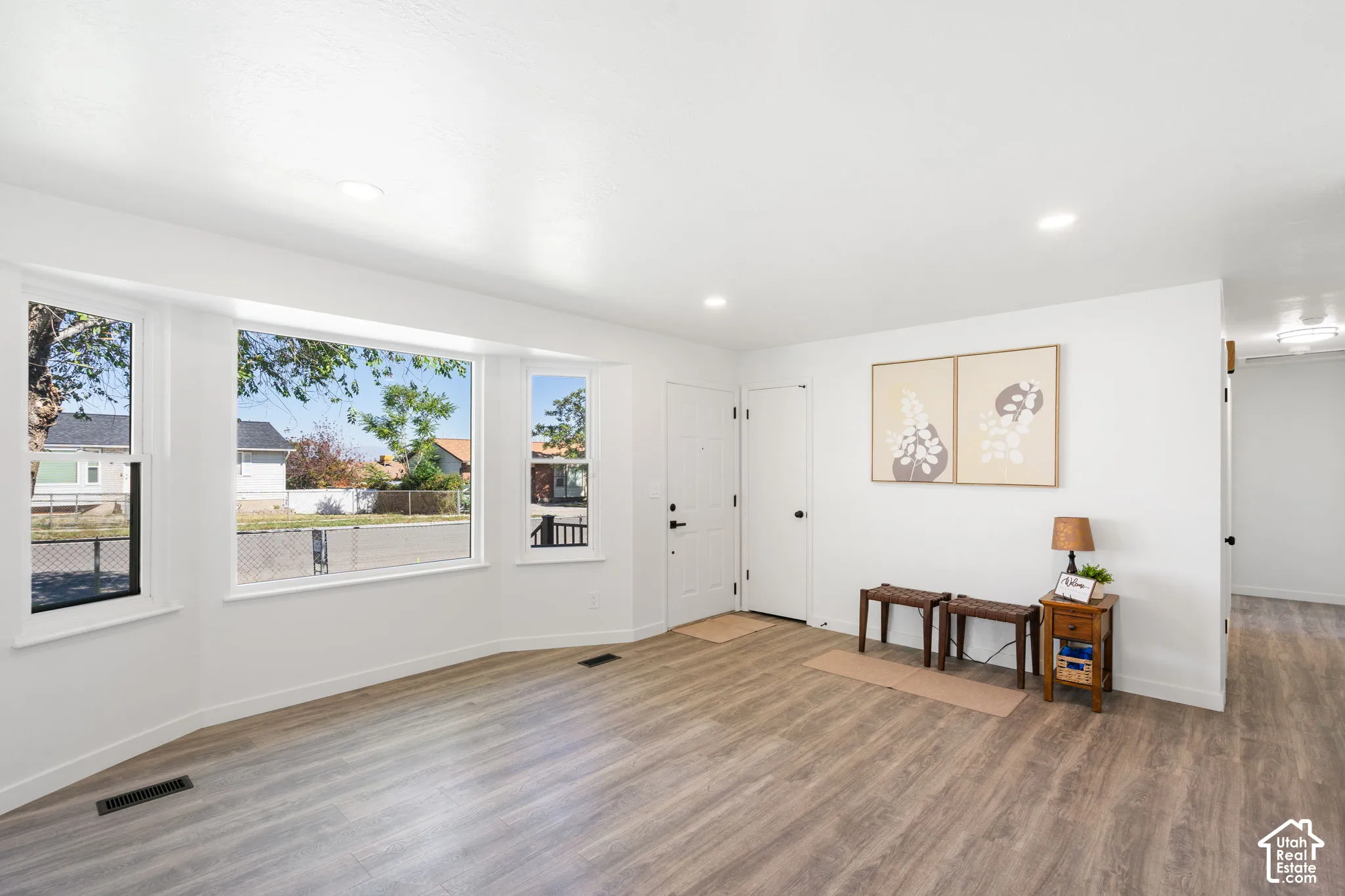 Bay windows providing tons of natural light, cute welcoming area.