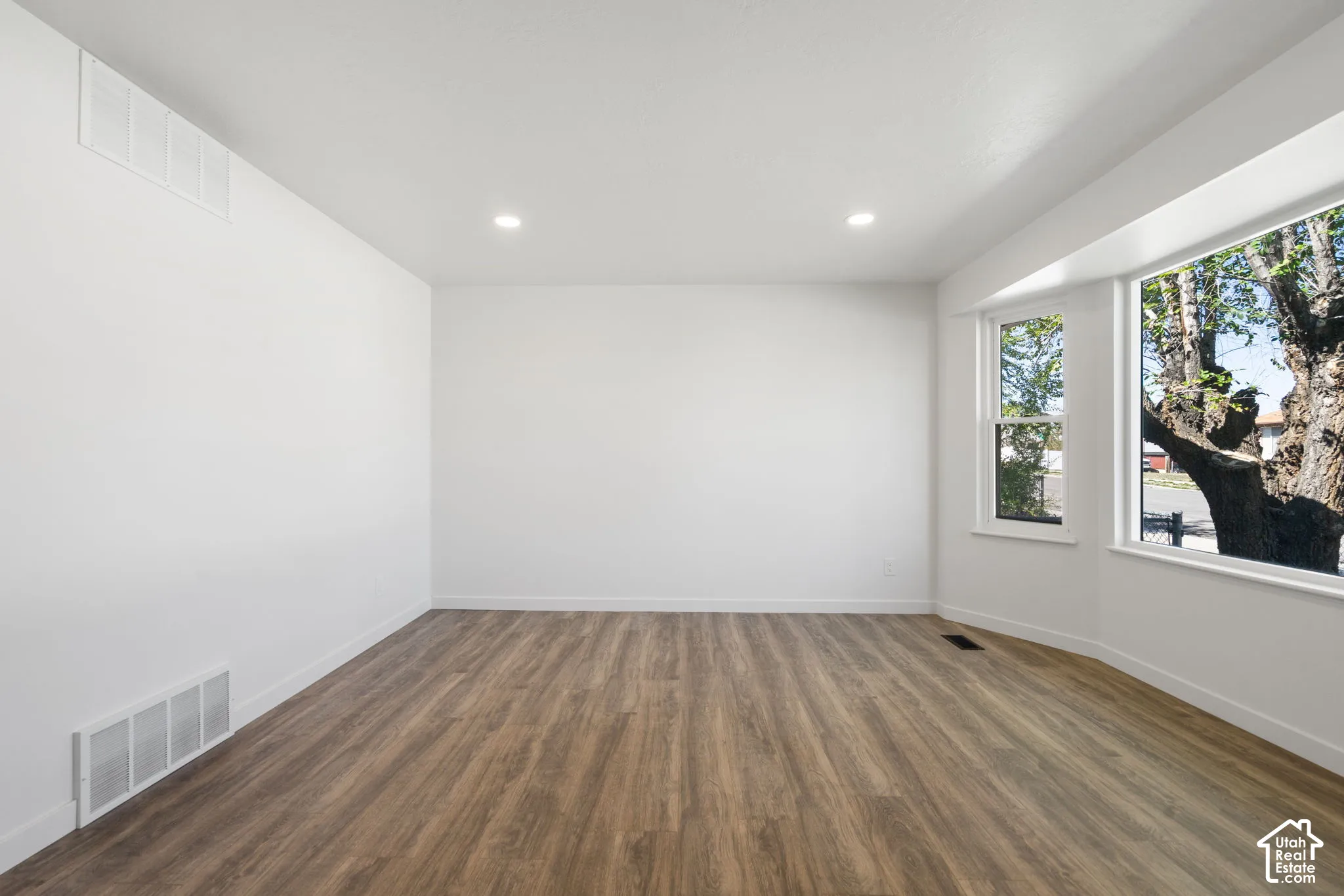 Freshly painted interior, recessed lights, new LVP floors, baseboards & trim.