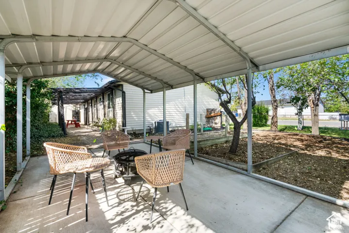 another view of covered canopy, pergola and garden.