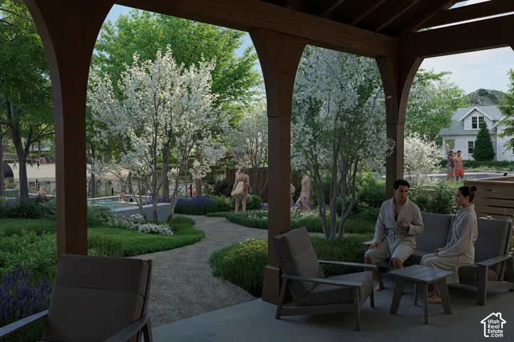 Covered outdoor lounge area with exposed wood beams