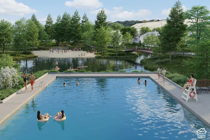 Outdoor swimming pool with integrated steps, surrounded by a paved deck