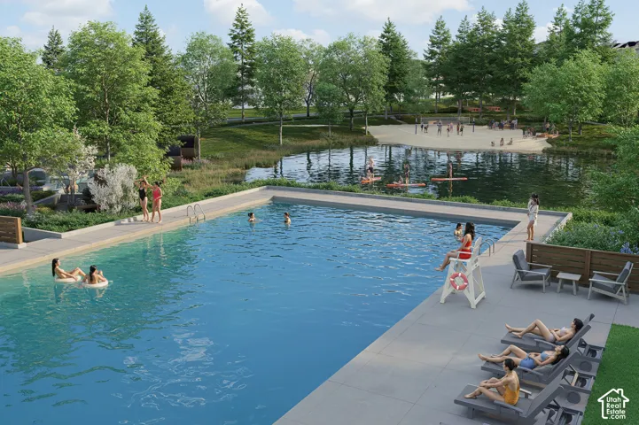 Outdoor swimming pool with integrated steps, expansive concrete decking, and adjacent lounge seating