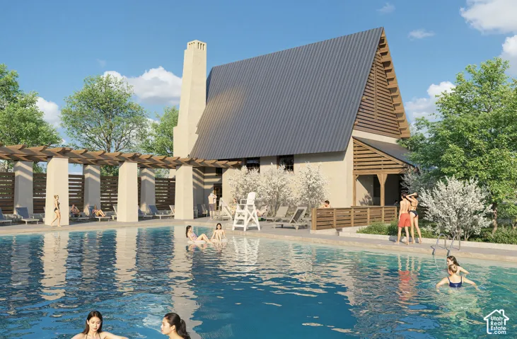 Expansive swimming pool with a surrounding hardscape deck, adjacent to a structure featuring a tall chimney and an A-frame roof