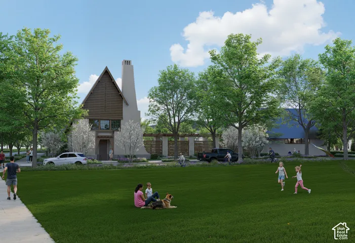 Expansive green space featuring a concrete pathway, mature trees, and a distant two-story residence with a prominent chimney