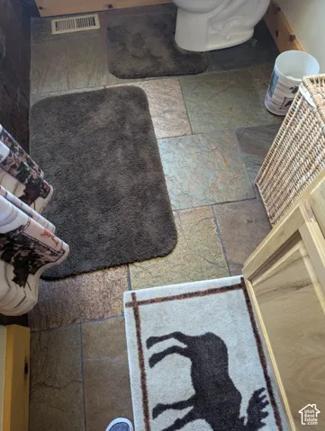 Natural slate tile flooring with varied color tones