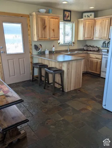 Kitchen with bar, Knotty Alder cabinetry & slate tile flooring - plus all appliances included!