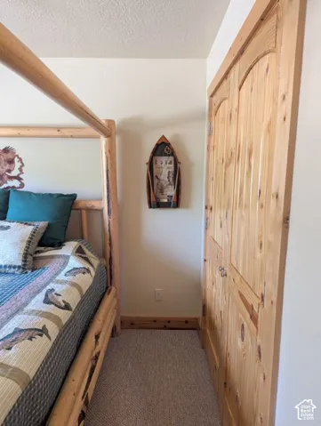Bedroom with ceiling fan & custom wood trim/closet doors