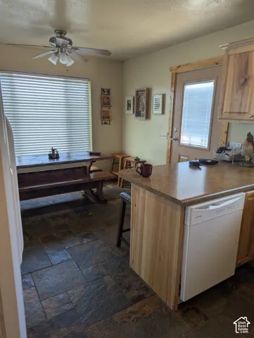 Kitchen & Dining with bar, Knotty Alder cabinetry & slate tile flooring - plus all appliances included!