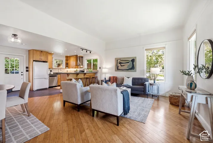 Bright living area , hardwood flooring, freshly painted walls