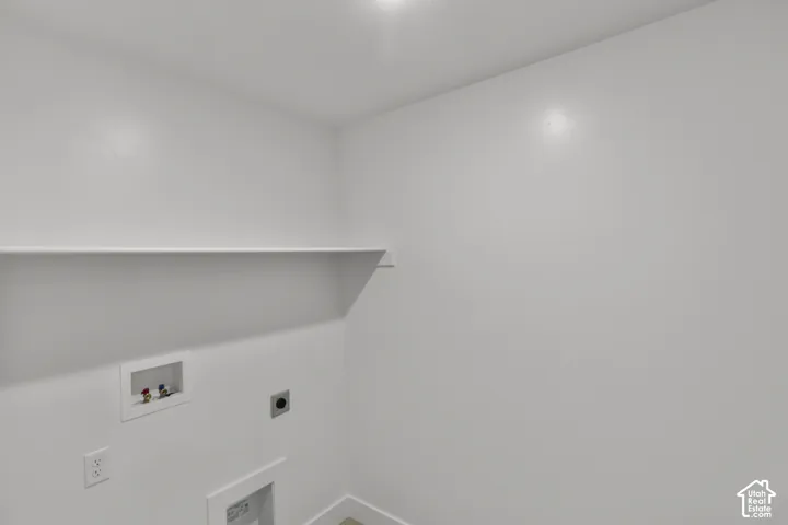 Built-in shelving, white walls, and a recessed light fixture
