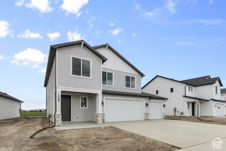 Light gray horizontal siding exterior with dark trim accents