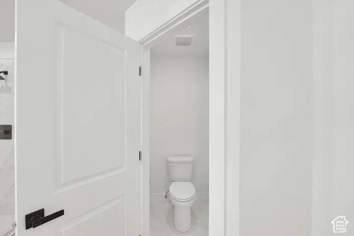 White paneled door with matte black hardware