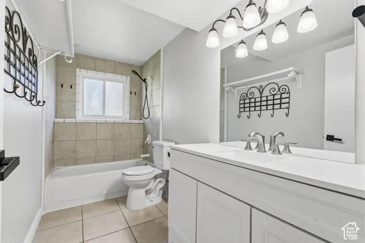 White vanity with dual-handle faucet and integrated sink