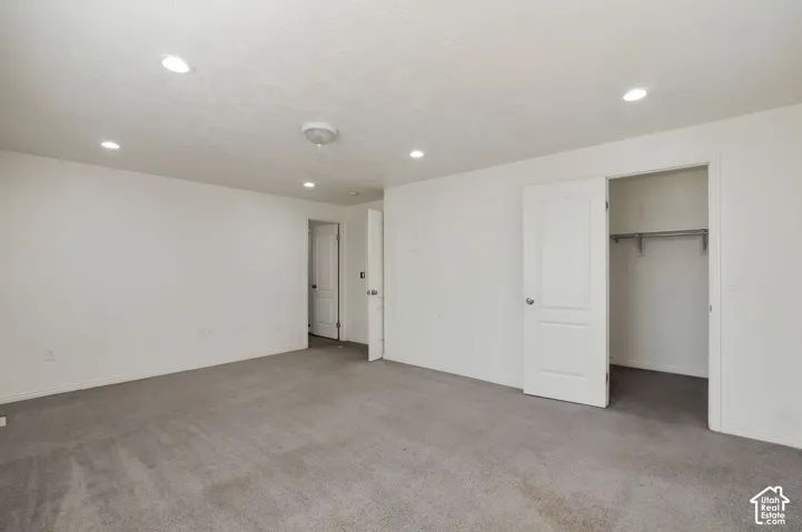 Recessed ceiling lighting, flush mount ceiling fixture, and a light-toned carpeted floor