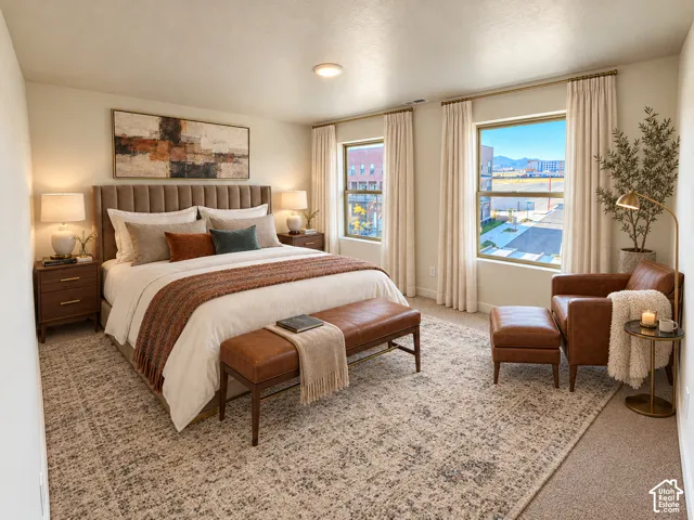 Spacious bedroom featuring large windows, neutral wall tones, and recessed ceiling lighting