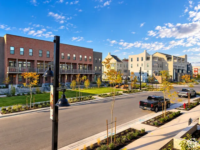 Row of contemporary townhomes featuring brick and stucco facades
